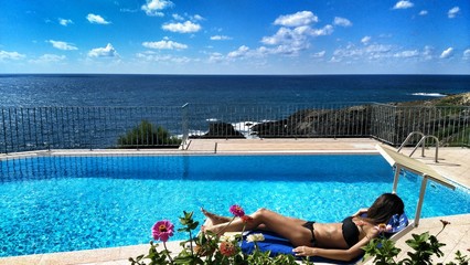 woman in the pool sunbathing
