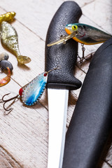closeup fishing baits and filet knife