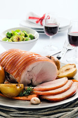 Traditional christmas table setting with pork roast