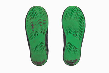 Dirty Used shoe green soles isolated on white background