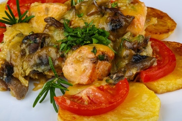 Roasted salmon with potato and tomato