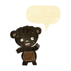 cartoon waving black bear with speech bubble