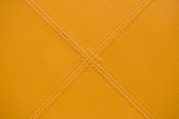 yellow leather with stitch texture and crosswise  symbol