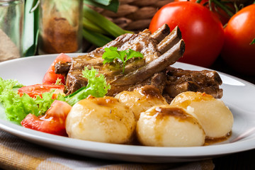 Pork spareribs served with silesian noodles and sauce