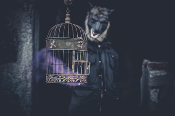 Ugly, man with mask wolf and lamp with colored smoke