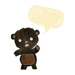 cartoon waving black bear cub with speech bubble