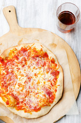 Rustic salami pizza with melted mozarella