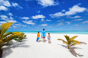 Father with kids at beach