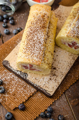 Sponge roll stuffed with strawberry cream