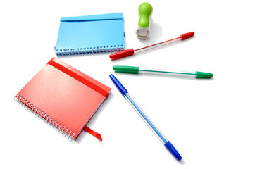 Notebooks, pens and stapler