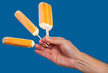 Hand holding ice cream bars