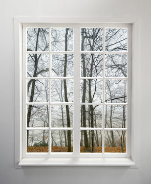 Fototapeta Modern residential window with forest view during autumn