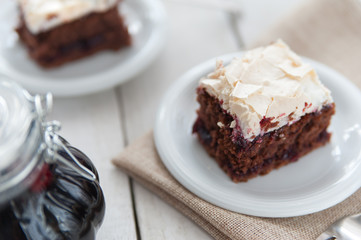 Piece of cherry and meringue cake
