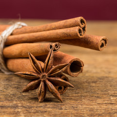 Close up of cinnamon sticks and star anise on wood