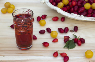 Red corne, cherry-plum  and juice with ice