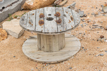 Big old wooden roll on rock coastal beach