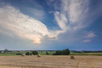 Stubble field with straw bales