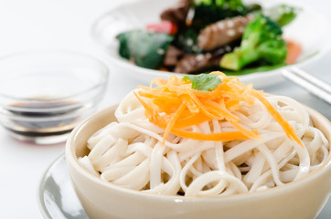 Delicious stir fry served with noodles