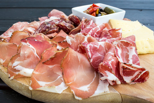 typical Italian appetizer with salami, cheese and pickles