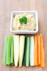 Healthy appetiser vegetable sticks with humus