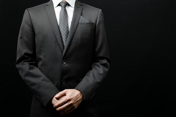 man in suit on a black background