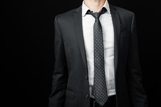 man in suit on a black background