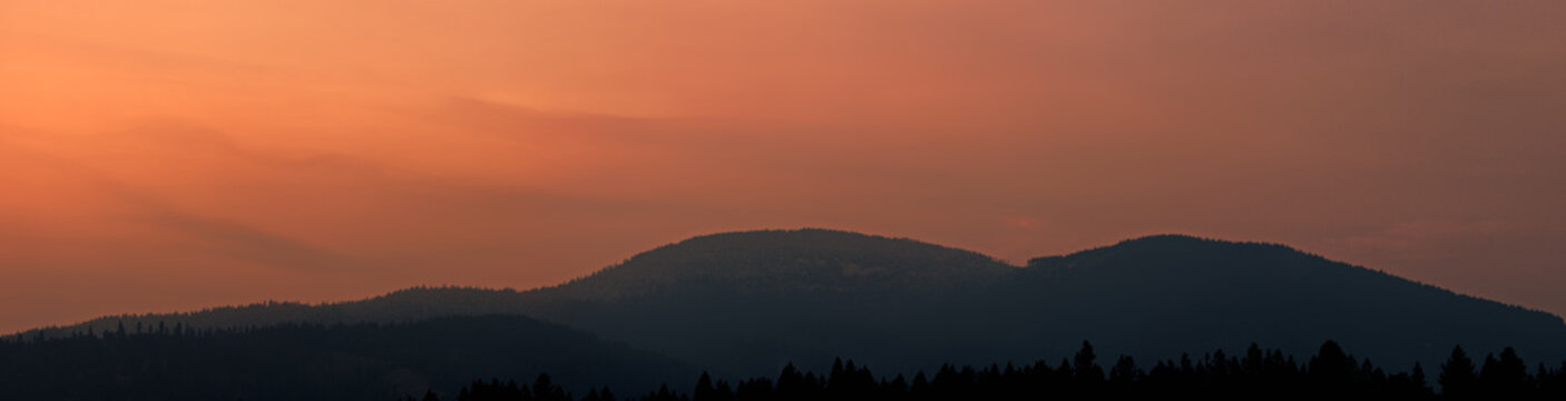 A panoramic image of Rathdrum Mountain in Idaho during sunset.