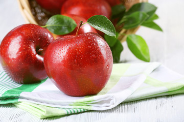Ripe red apples on table close up