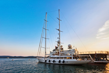 Fototapeta na wymiar Yacht in marina at sunset.