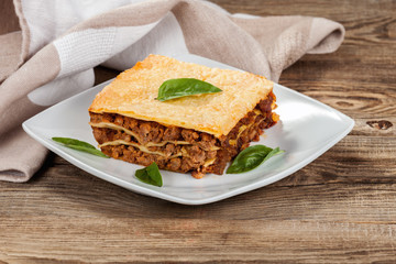 Fresh hot lasagna on old boards