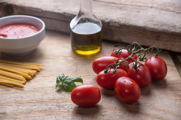 Ingredients for a typical italian lunch lying on a wooden table