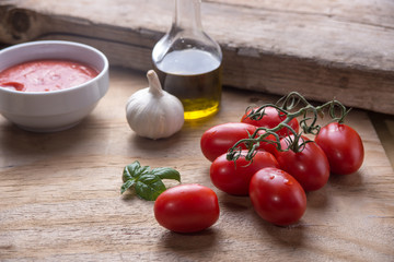 Ingredients for a typical italian lunch lying on a wooden table