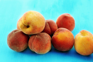 Sweet ripe peaches on table close up