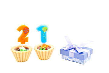 cakes with twenty one years birthday candles and gift