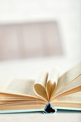 Pages of book curved into heart shape, close up