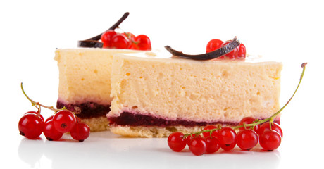 Tasty pieces of cheesecake with berries isolated on white