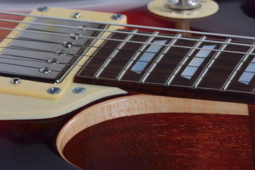 Fototapeta na wymiar Detailed view on the brown electric guitar