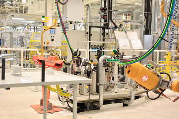 Part of the welding in a large automobile factory