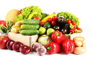 Composition with fresh fruits and vegetables isolated on white