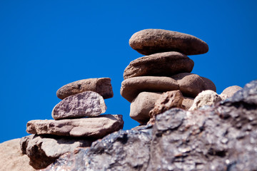 Fototapeta na wymiar Stacked stones with blue sky