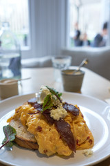 Local Australian Cuisine. Breakfast : Chilli scrambled eggs with cured Flinders Island wallaby, feta and salad leaves. 