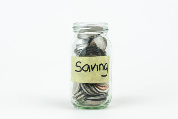 Jar for savings full of coins.