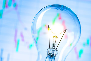 Business success with stock graph and light bulb