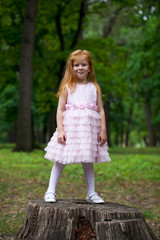 Full length portrait of little redheaded girl