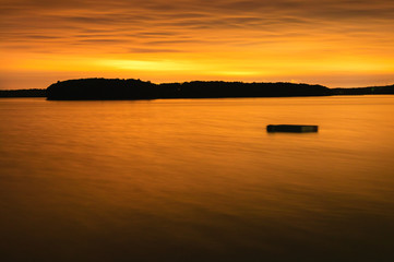 Floating dock in a bay at night.