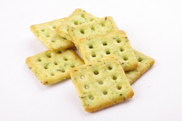 Crispy mint crackers in square shape on white background