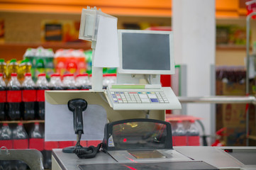 Empty cash desk with computer terminal in supermarket
