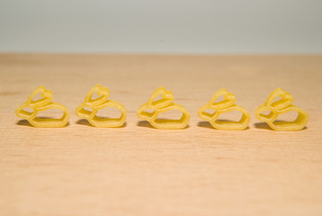 Pasta in the form of rabbits on a wooden surface