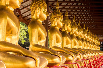 Fototapeta premium Monk golden image of Buddha
