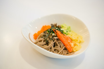 Noodle dish with vegetables and spices in Japanese restaurant